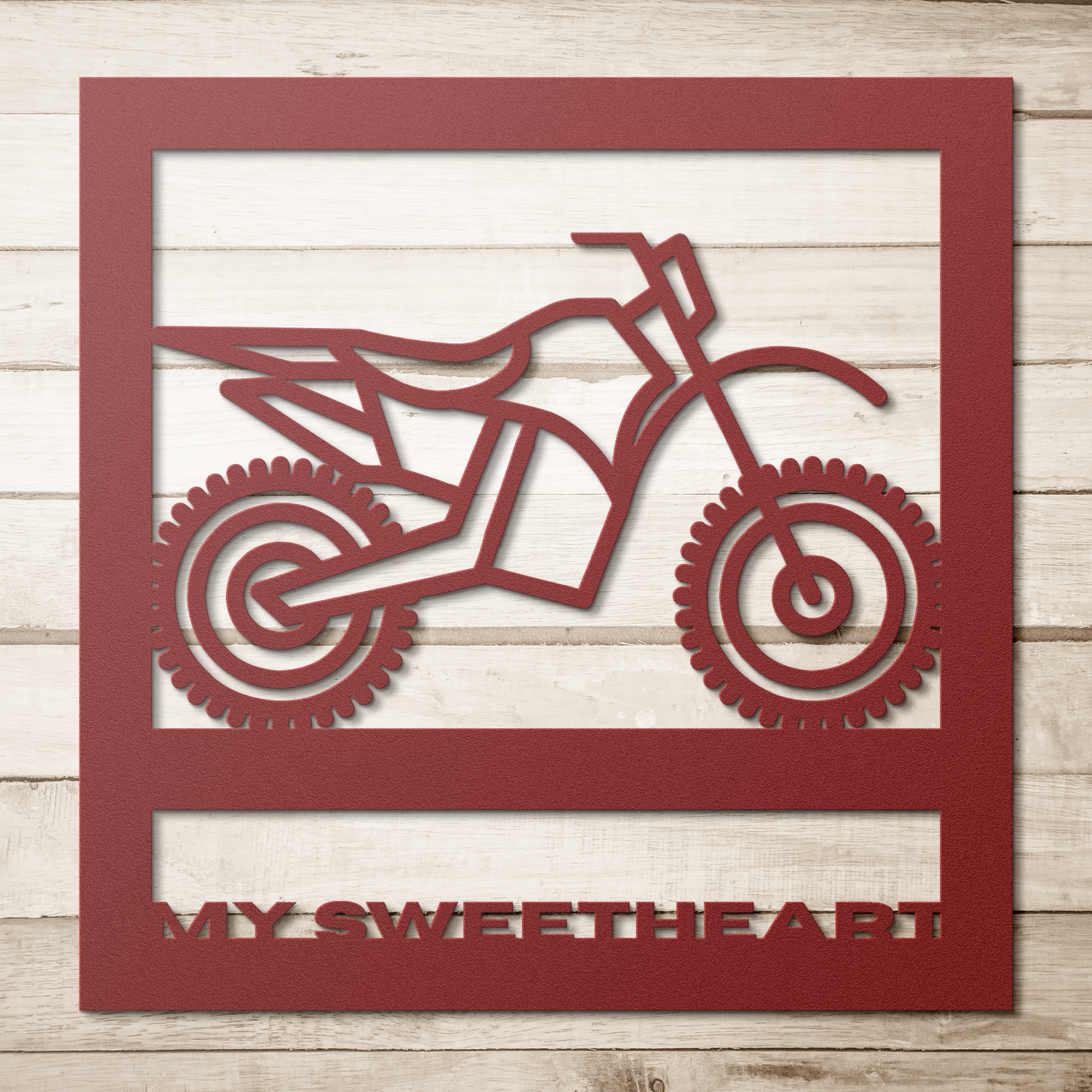 Hypnotic_Metal_Wall_Art_Dirt_Bike_Frame_Red_Simple_Wood_BKGD_Mockup.png